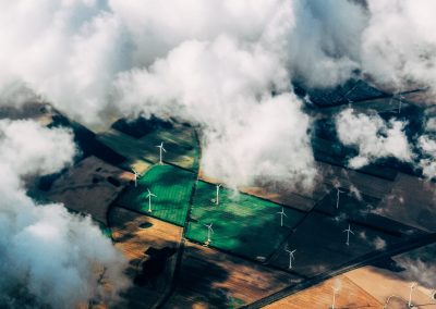 Wind farm in clouds - photo by Thomas Richter at unsplash